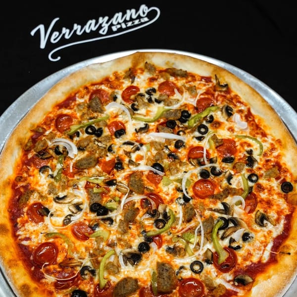 Verrazano Pizza's loaded pizza with pepperoni, sausage, olives, mushrooms, onions, and peppers.
